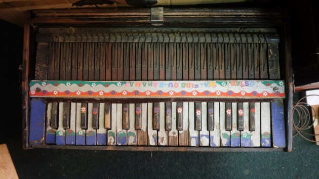 1 - A colorful harmonium waiting to go under repair at Saleem and Sons