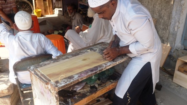 3 - A craftsman works with a piece of wood which will be used in the harmonium